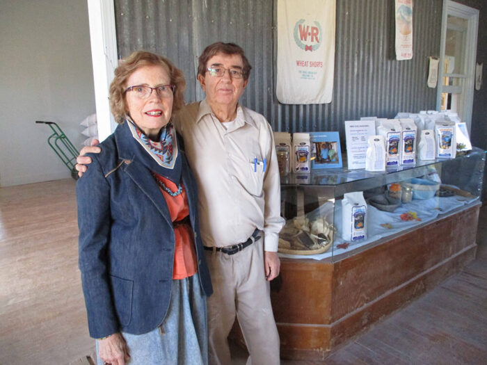 Couple standing at shop